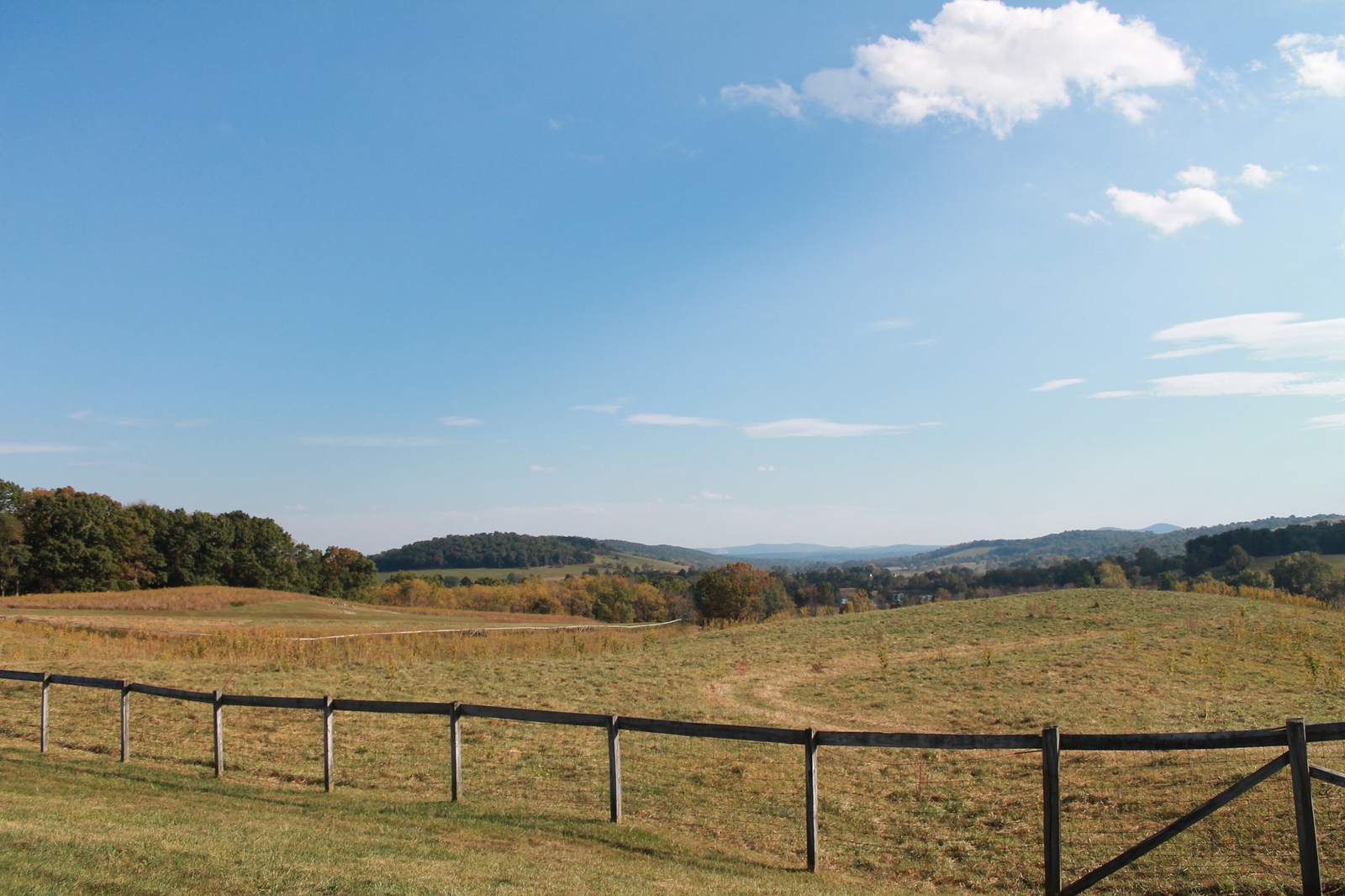 Post-and-rail fence along rolling pasture and hay ground near Markham, Fauquier County, Virginia